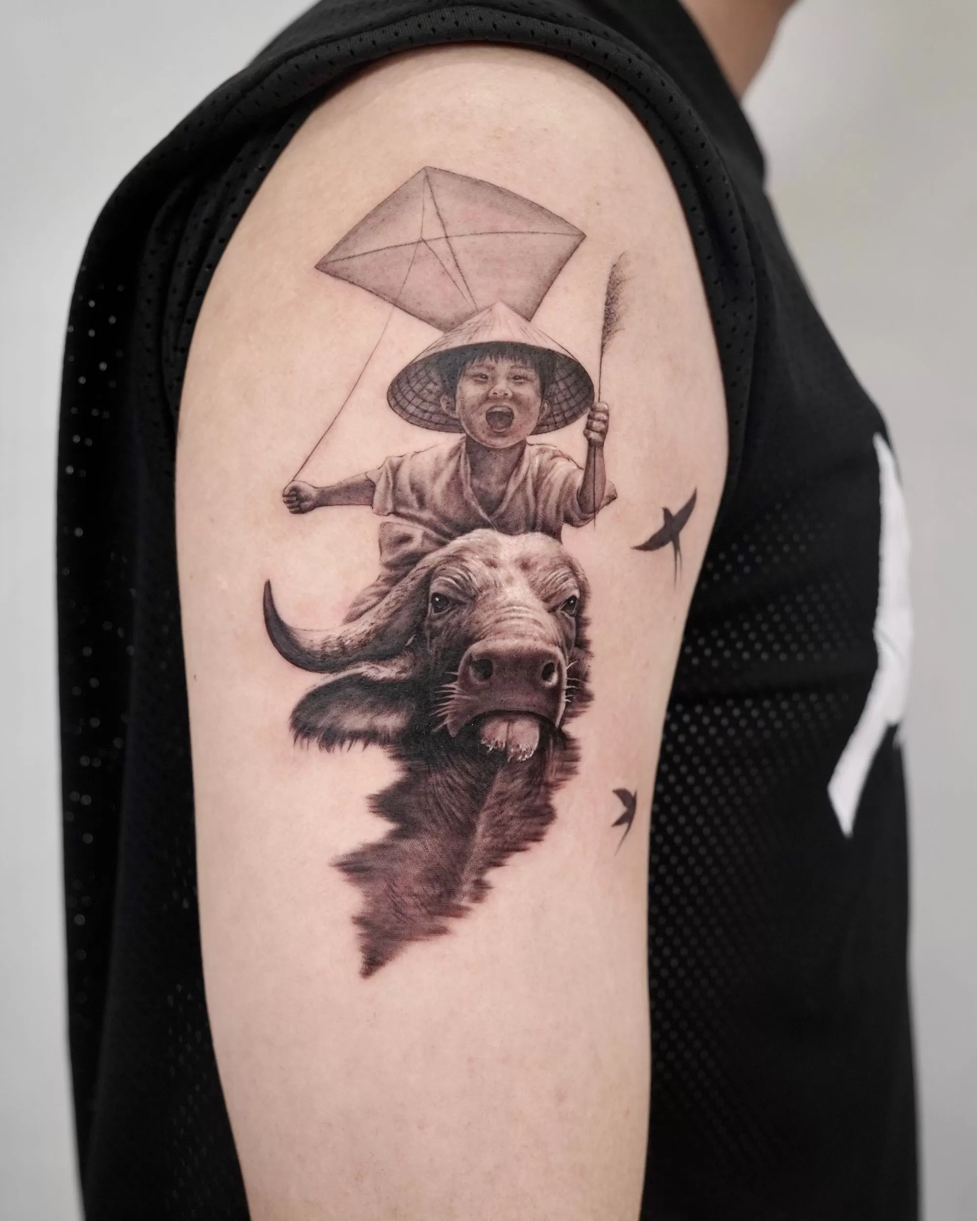 1752534285 Black Grey Realistic Vietnam Boy On Buffalo Tatoo