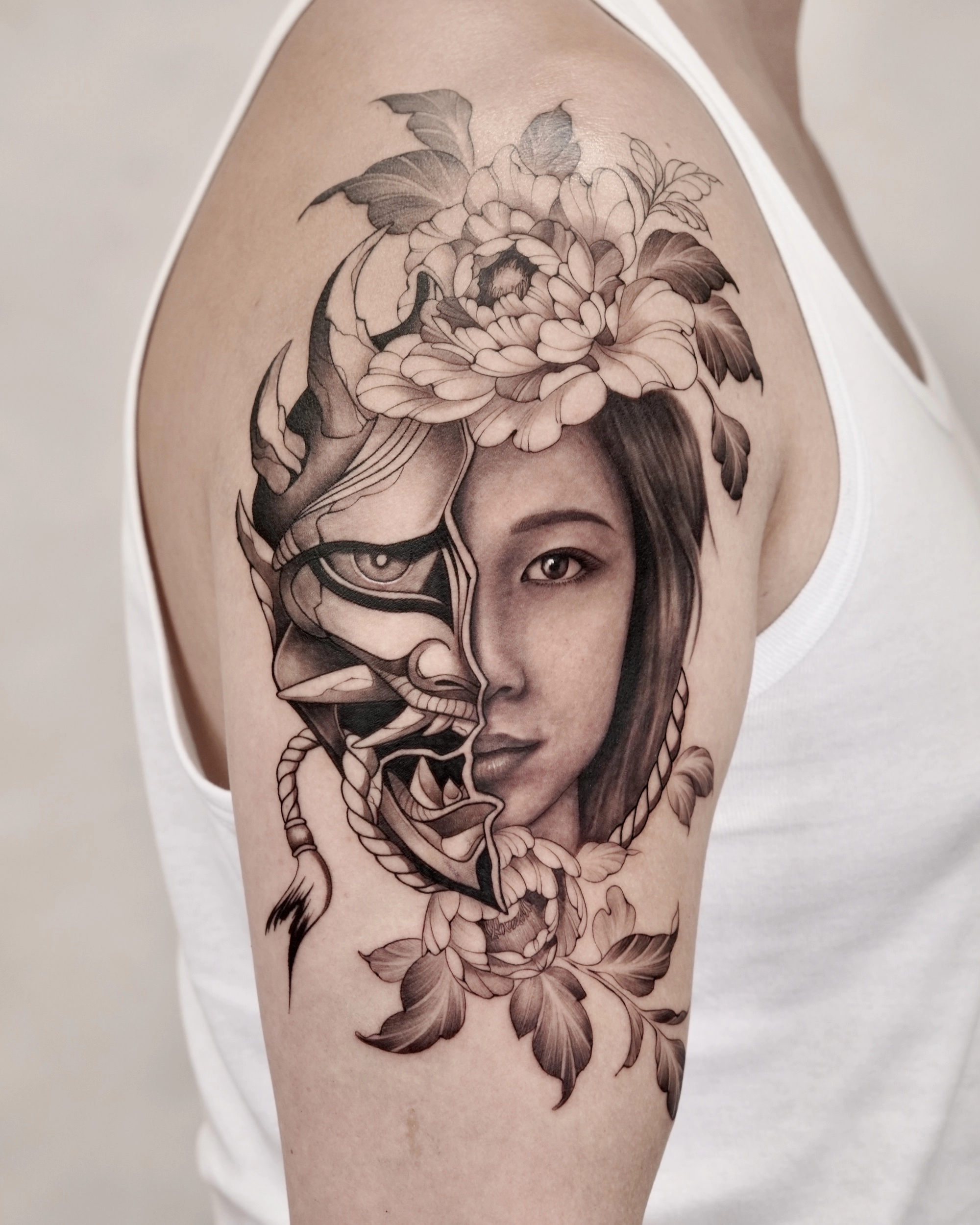 1764063292-6373-black-grey-half-hanya-mask-half-portrait-tattoojpg