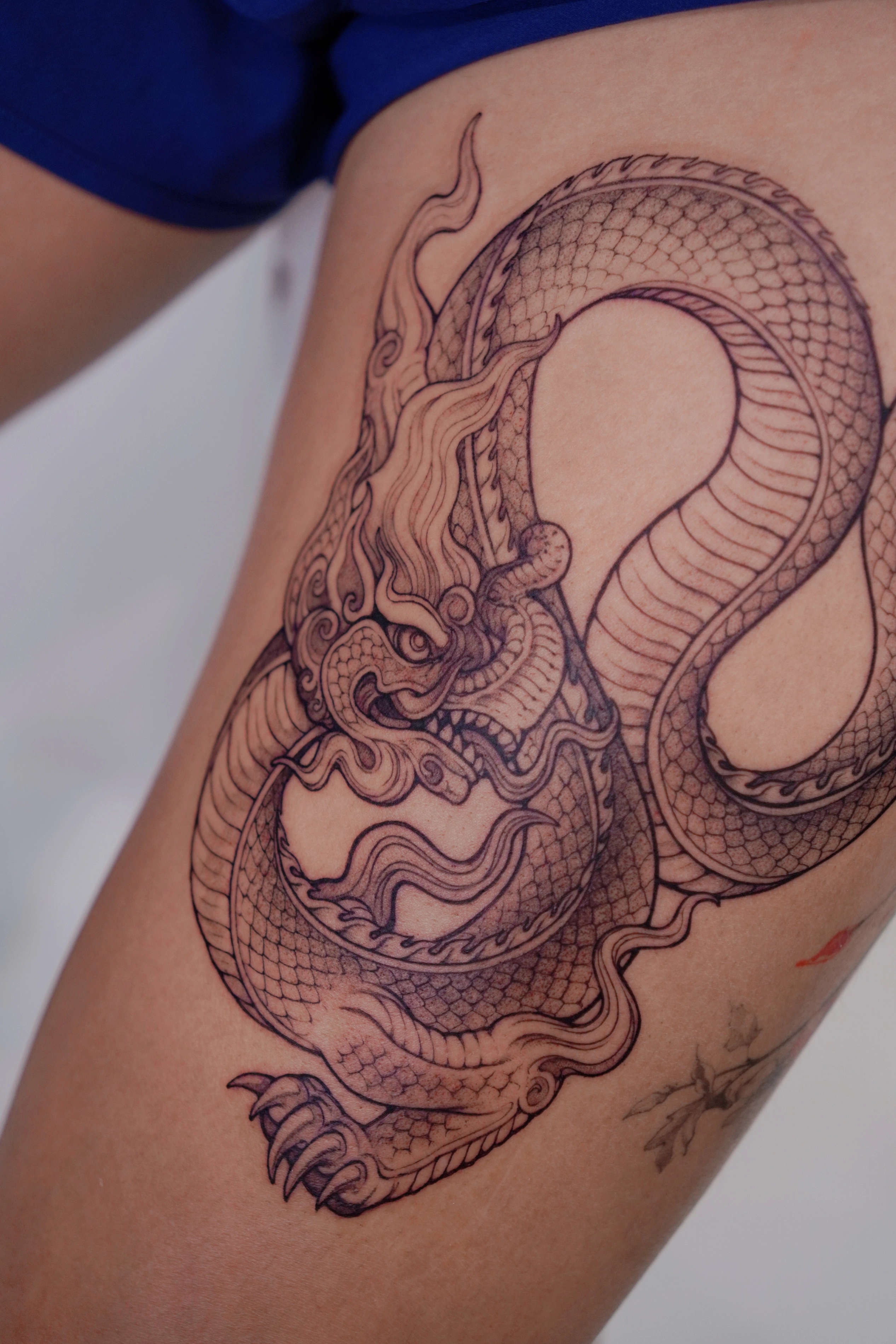 1768882356-ly-dynasty-dragon-line-work-tattoo-1