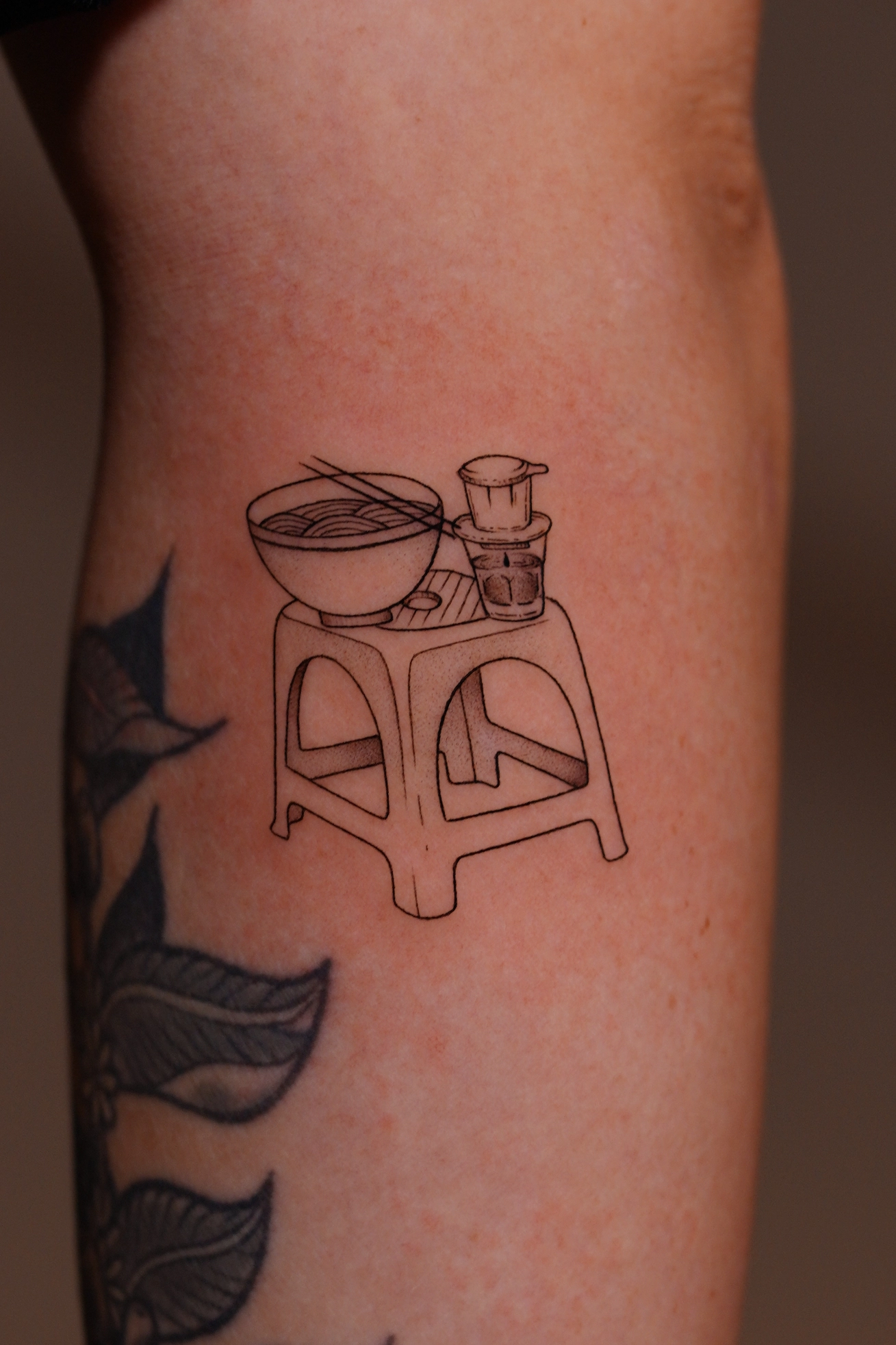 1768884056-pho-bowl-coffee-plastic-chair-minimal-tattoo-1