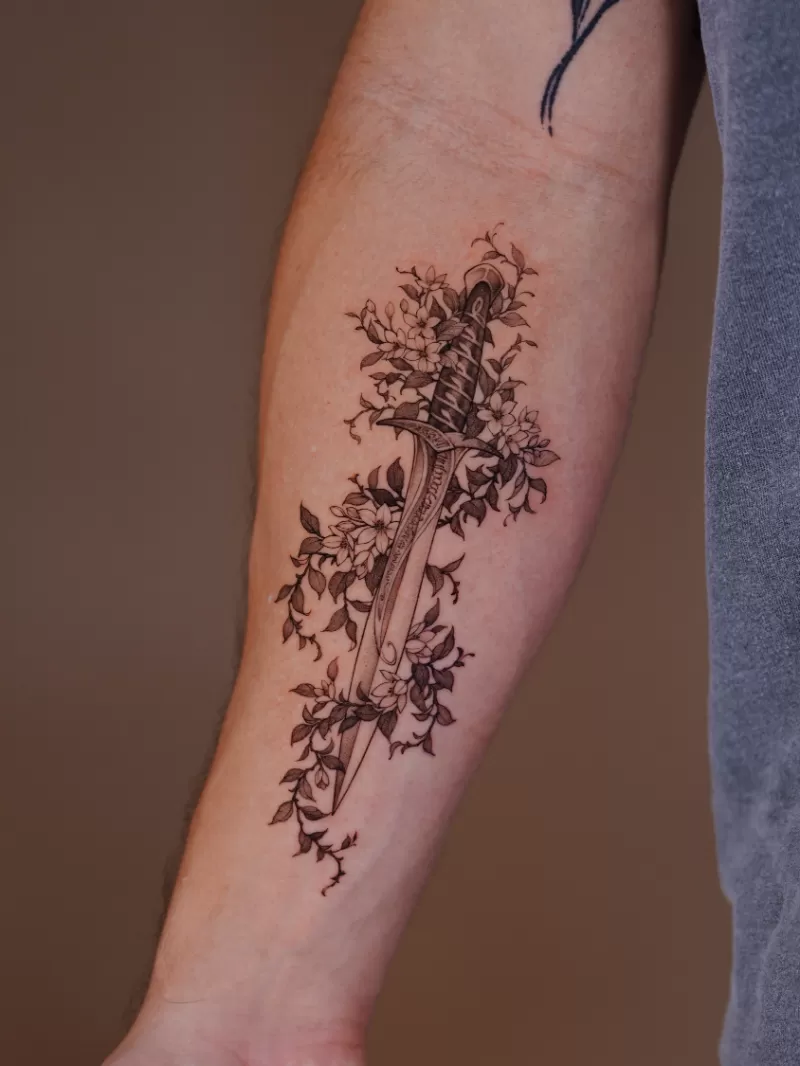 1774606845 Fine Line Flower Dagger Tattoo 1